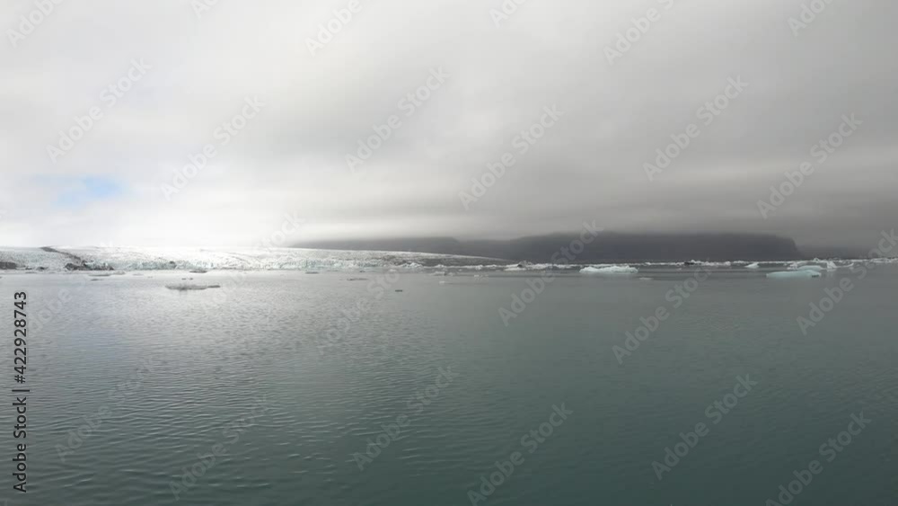 Floating melting icebergs in Jokulsarlon glacial lagoon, Iceland. Global warming and climate change problem concept Floating melting icebergs in Jokulsarlon glacial lagoon, Iceland. Global warming and climate change problem concept