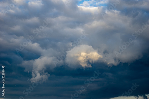 Cumulus clouds in a blue sky.