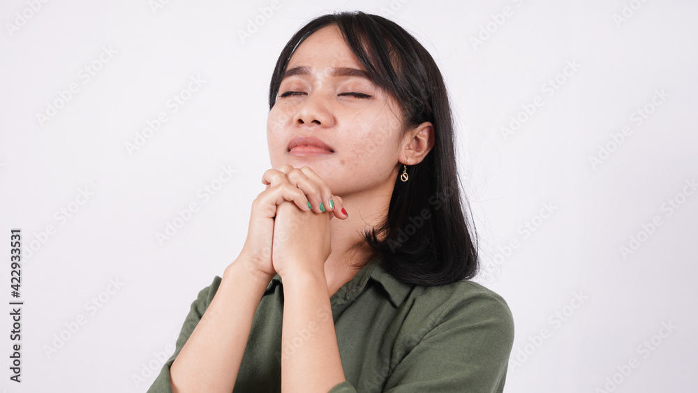 a Christian woman praying humbly isolated white background a Christian woman praying humbly isolated white background