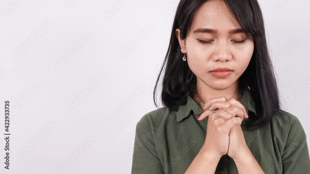 a Christian woman praying humbly isolated white background a Christian woman praying humbly isolated white background