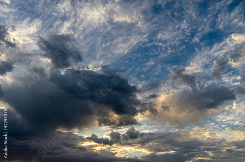 Cumulus clouds in a blue sky.