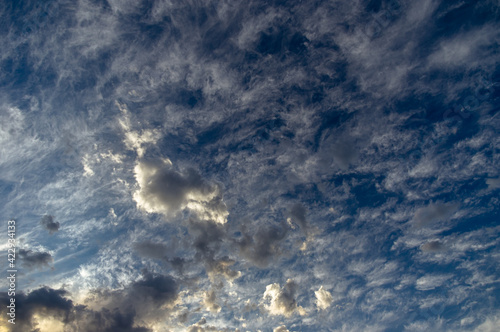 Cumulus clouds in a blue sky.