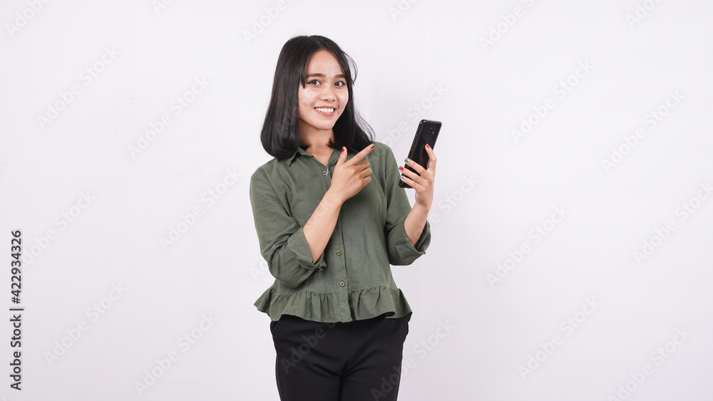 happy asia woman pointing telephone on a white isolated background happy asia woman pointing telephone on a white isolated background