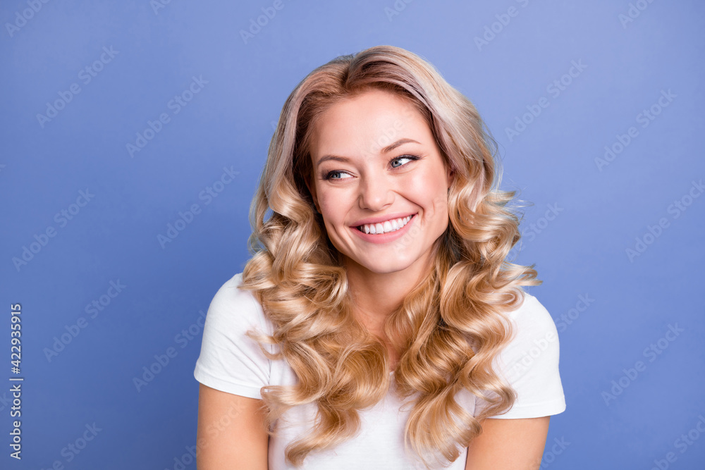 Photo of young happy cheerful smiling pretty lovely gorgeous dreamy girl look copyspace isolated on blue color background Photo of young happy cheerful smiling pretty lovely gorgeous dreamy girl look copyspace isolated on blue color background