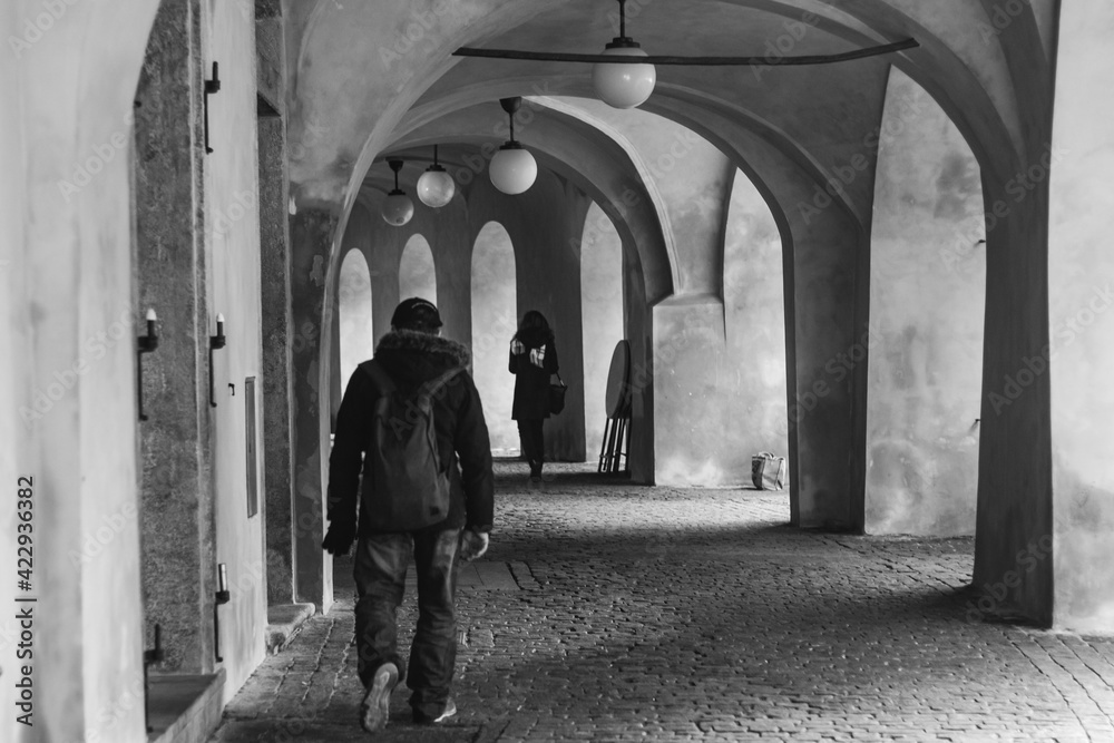 people walking in the old alleys of prague