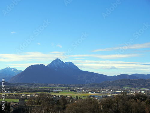 Panorama of the Austrian countryside near Salzburg .. Plains and mountains on a sunny day.