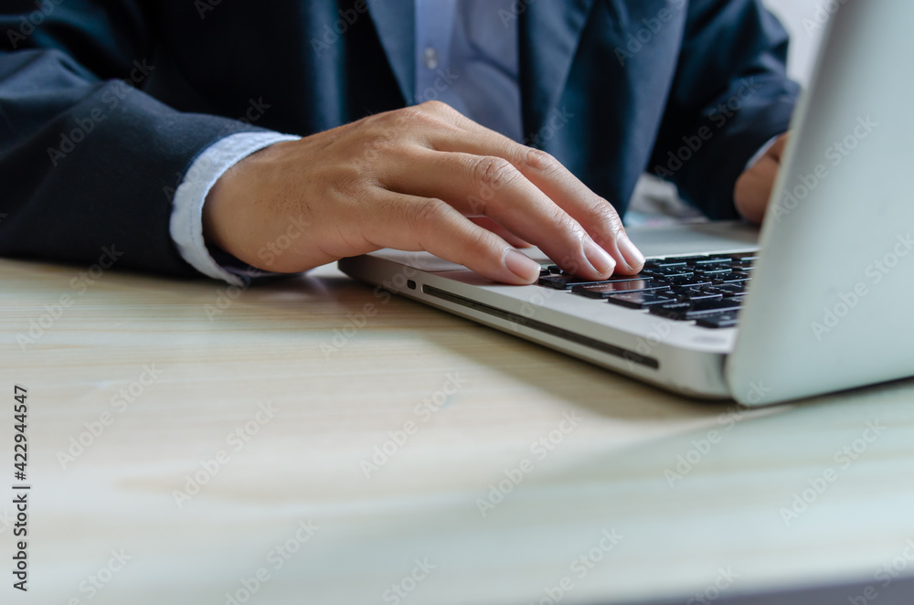 business man typing on keyboard computer laptop. business man typing on keyboard computer laptop.