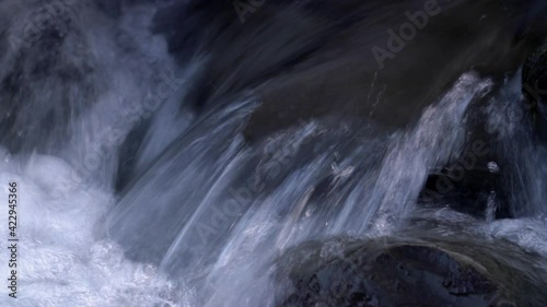 Water Flowing By Rocks In Grundarfoss, Iceland. - close up photo