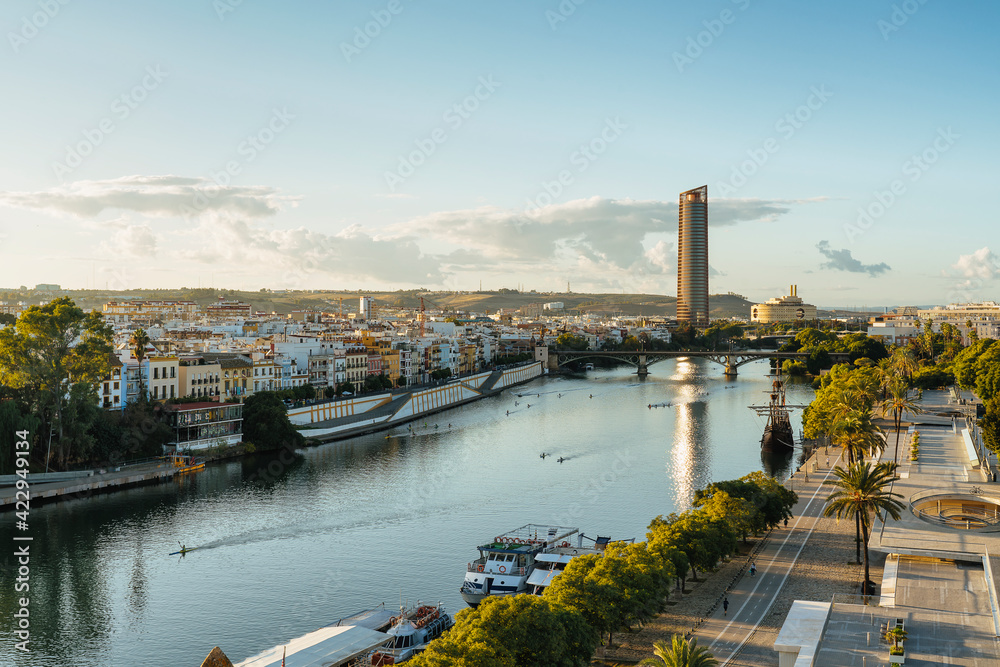 Naklejka premium Panoramic view of Guadalquivir River with Triana and Seville Tower, Spain