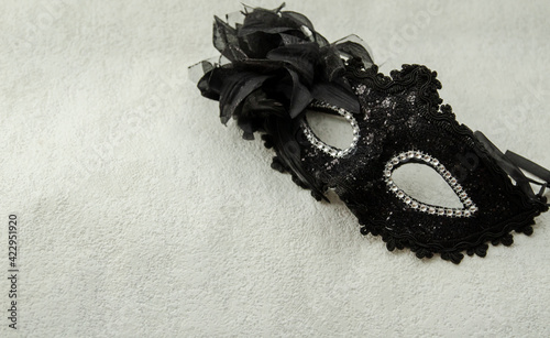 black masquerade mask with sequins. close-up