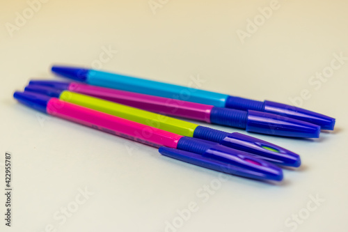 colorful pens lie on the desk close-up