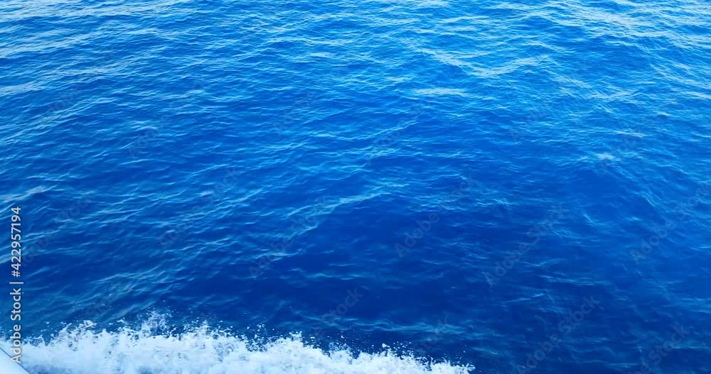 top of the view of blue sea wave movement from the boat, concept of turist travel holiday top of the view of blue sea wave movement from the boat, concept of turist travel holiday
