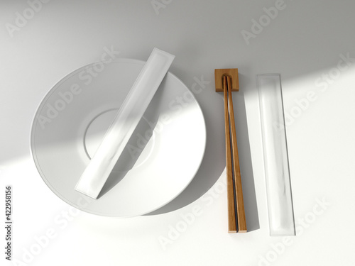 Foto Two Plain White Chopsticks Packaging on Plate with wooden chopsticks on isolated