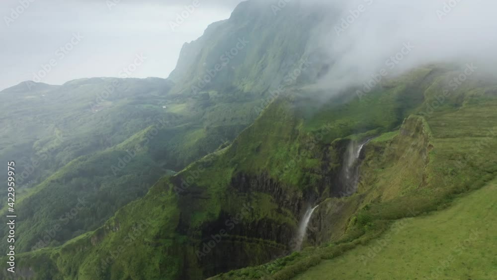 Poco Ribeira do Ferreiro, Flores Island, Azores, Portugal. Drone footage of laurisilva forest and moss. Amazing natural beauty with lush vegetation and streaming waterfall. High quality 4k footage Poco Ribeira do Ferreiro, Flores Island, Azores, Portugal. Drone footage of laurisilva forest and moss. Amazing natural beauty with lush vegetation and streaming waterfall. High quality 4k footage