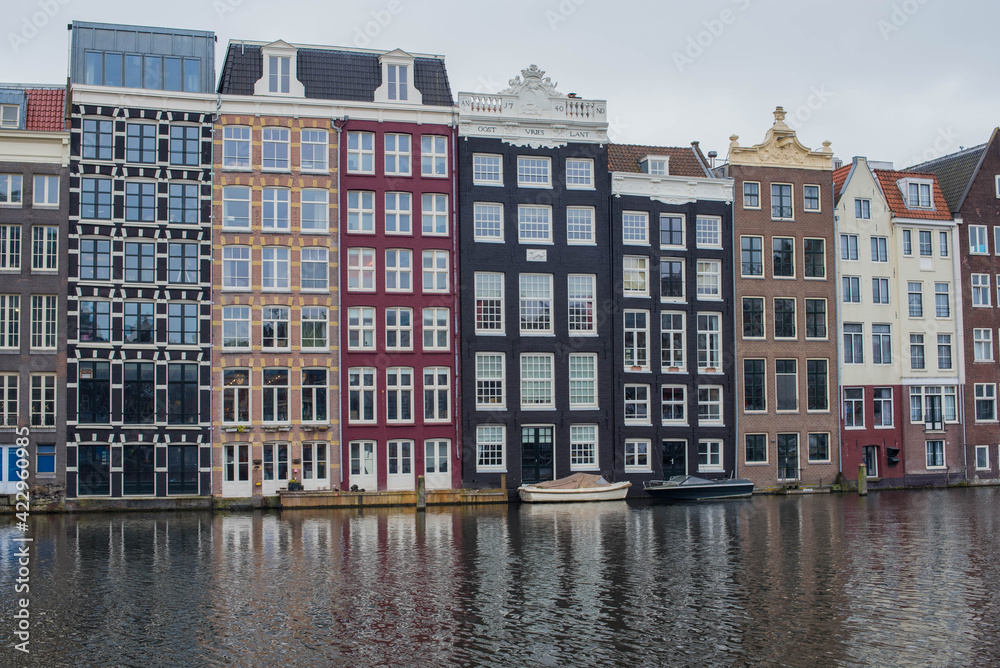 Amsterdam canal houses and their reflections in the water