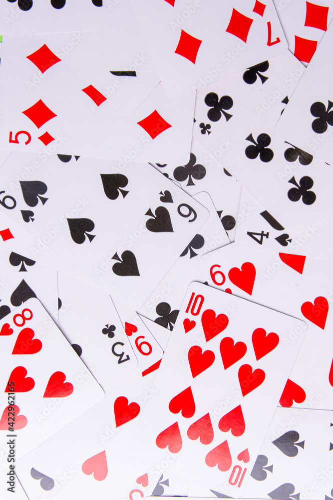 Playing cards on a green background. From above. low cards Playing cards on a green background. From above. low cards