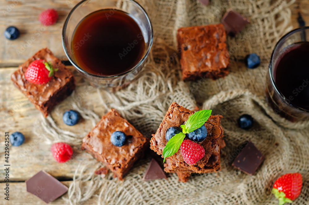 Chocolate brownie with berries and mint leaves Chocolate brownie with berries and mint leaves