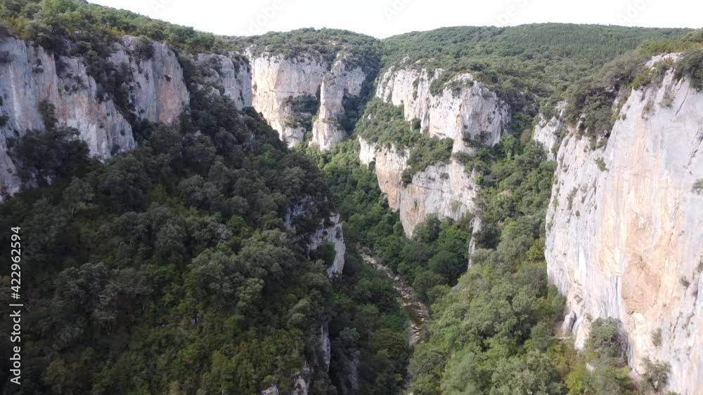 Aerial drone video above a river between cliffs in north Spain. Aerial drone video above a river between cliffs in north Spain.