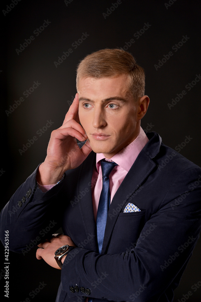 Portrait of young businessman posing in studio Portrait of young businessman posing in studio