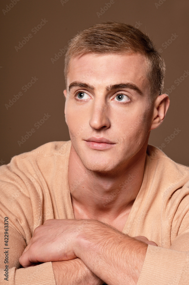 Obraz premium Portrait of handsome young man posing in studio