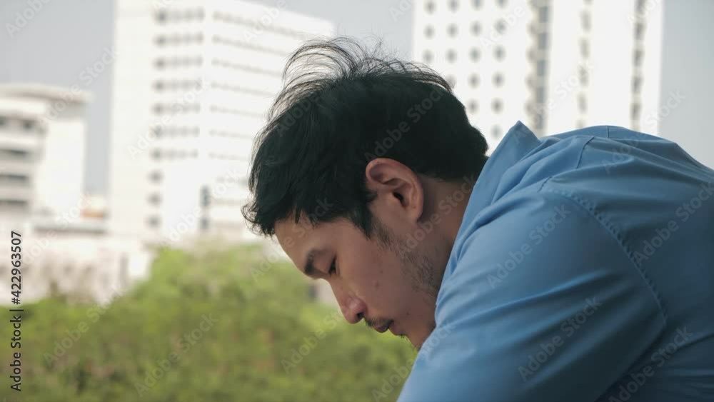 Depressed Asian businessman stressed from work. anxiety in adult cause to depression and a problem in living that drag you down to feeling sadness, lonely and worried. Depressed Asian businessman stressed from work. anxiety in adult cause to depression and a problem in living that drag you down to feeling sadness, lonely and worried.