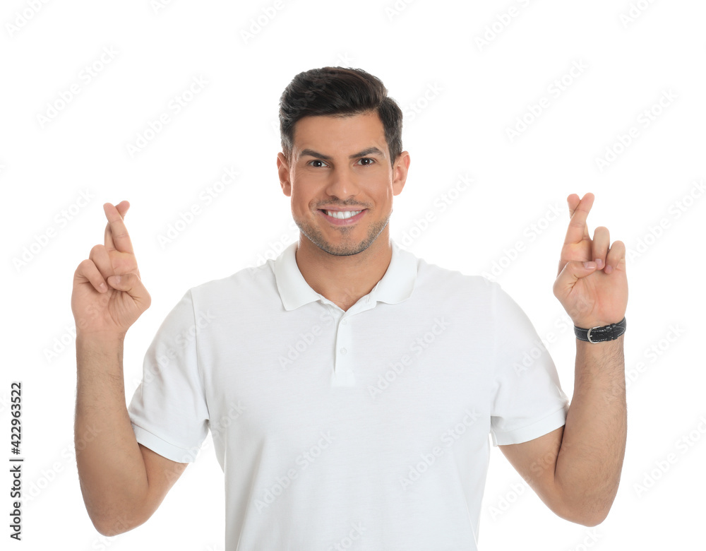 Man with crossed fingers on white background. Superstition concept Man with crossed fingers on white background. Superstition concept