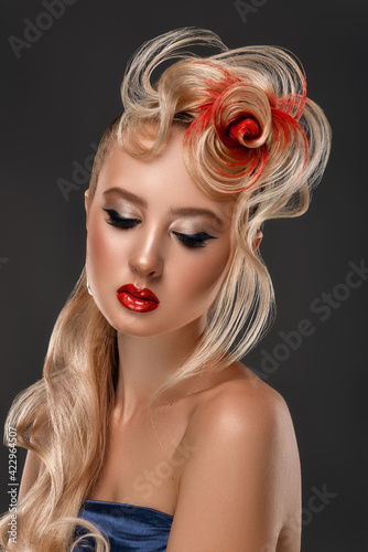Beauty Fashion Model Girl with Colorful Dyed Hair. Girl with perfect Makeup and Hairstyle. Model with perfect Healthy Dyed Hair. Red rose Hairstyles