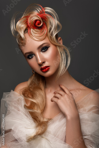 Beauty Fashion Model Girl with Colorful Dyed Hair. Girl with perfect Makeup and Hairstyle. Model with perfect Healthy Dyed Hair. Red rose Hairstyles