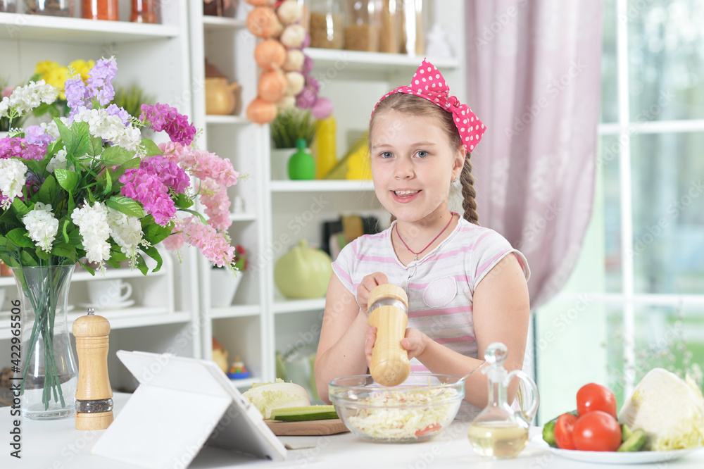 Cute girl preparing delicious fresh salad Cute girl preparing delicious fresh salad