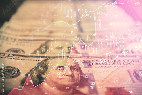 Double exposure of forex graph drawing over us dollars bill background. Concept of financial markets.