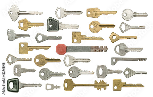 Different old keys on white isolated background