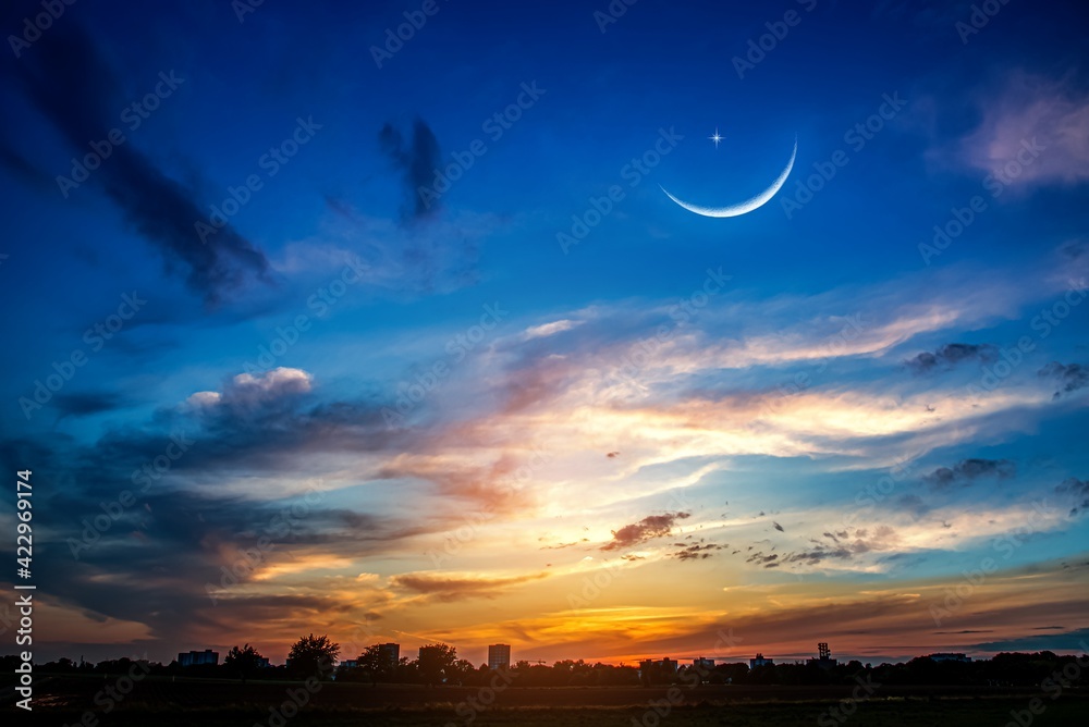 Crescent moon with beautiful sunset background