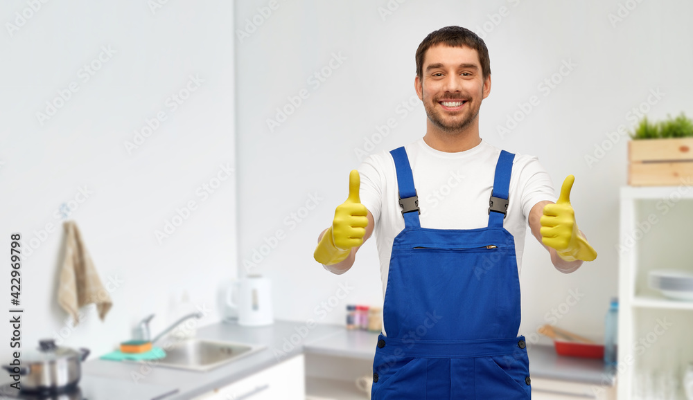 happy male worker or cleaner in gloves at kitchen happy male worker or cleaner in gloves at kitchen