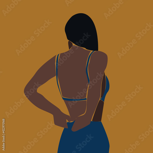 black woman in blue dress on yellow background