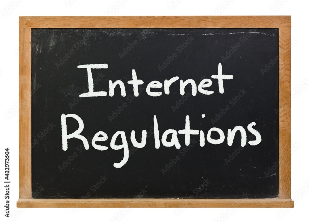 Internet Regulations written in white chalk on a black chalkboard isolated on white Internet Regulations written in white chalk on a black chalkboard isolated on white