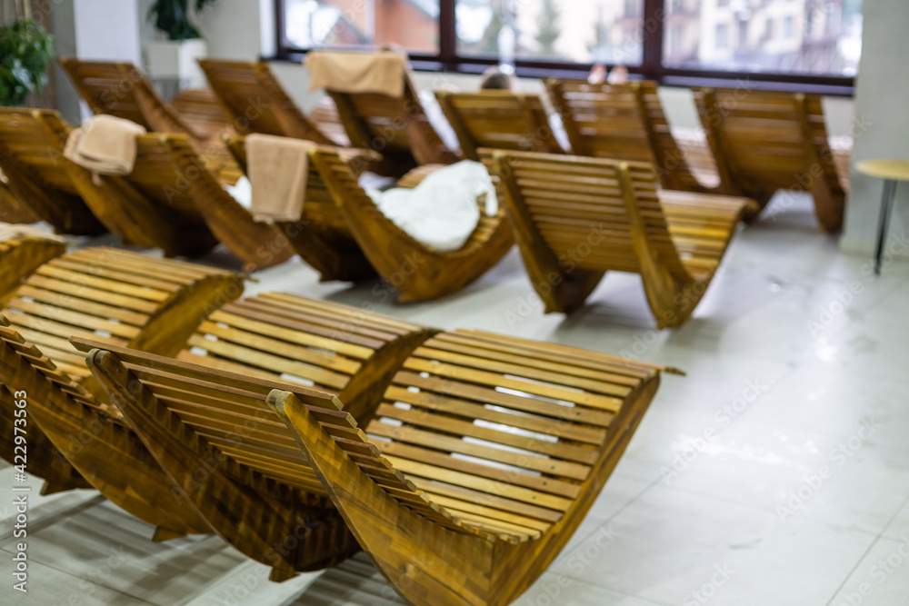Panorama of wooden fancy loungers in resting space