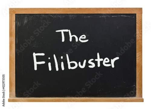 Obraz na płótnie The Filibuster written in white chalk on a black chalkboard isolated on white