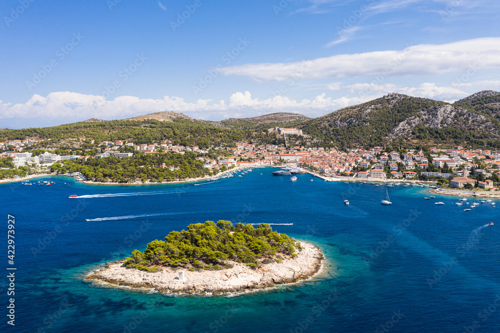 Stunning aerial view of the famous Hvar island and old town in Croatia on a sunny summer day
