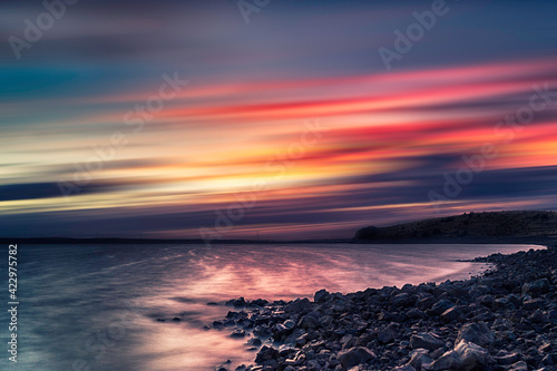 Sunset by a river. Long-exposure photography