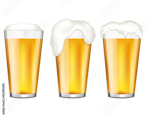 Realistic glasses of beer with bubbles and flowing white foam, isolated on white background.