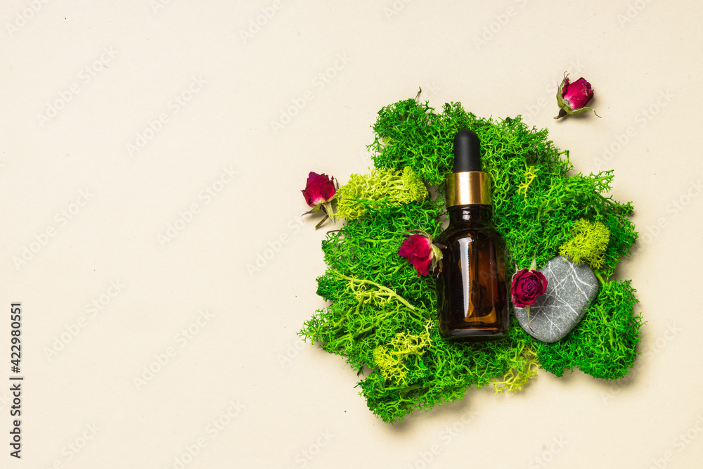 Serum bottle with moss at natural background. Serum bottle with moss at natural background.