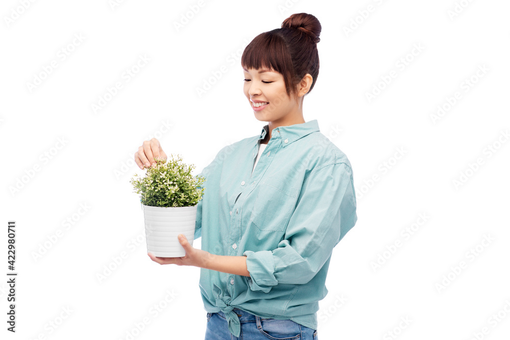 happy smiling asian woman holding flower in pot happy smiling asian woman holding flower in pot