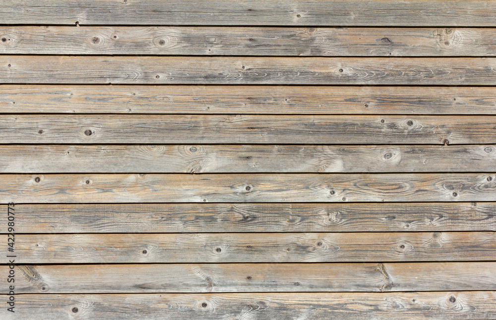 Obraz premium Natural wooden background.An old wooden wall darkened with age.