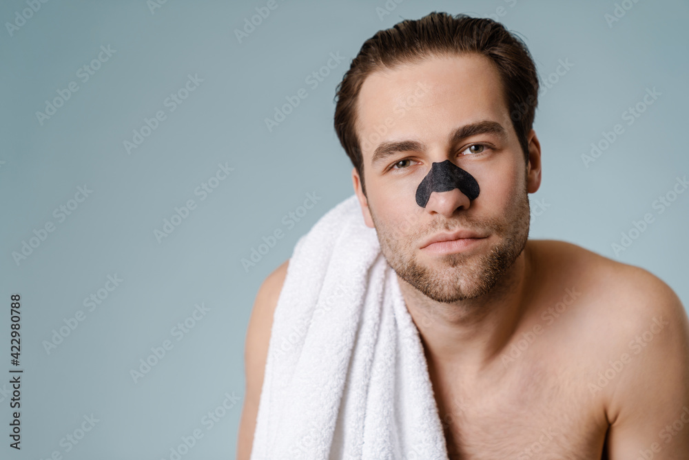 Obraz premium Close up of a brunette shirtless man with stubble