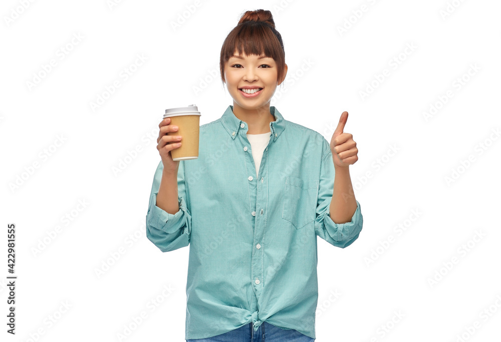 asian woman with coffee cup showing thumbs up asian woman with coffee cup showing thumbs up