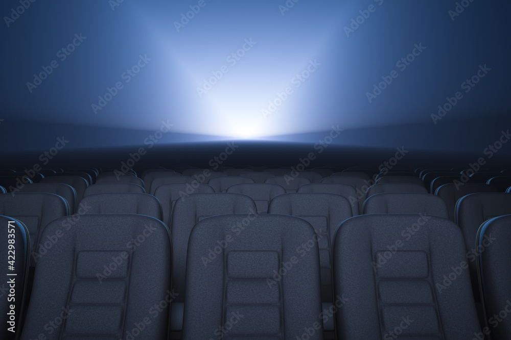 Obraz premium Empty cinema room. Working movie projector in the background.