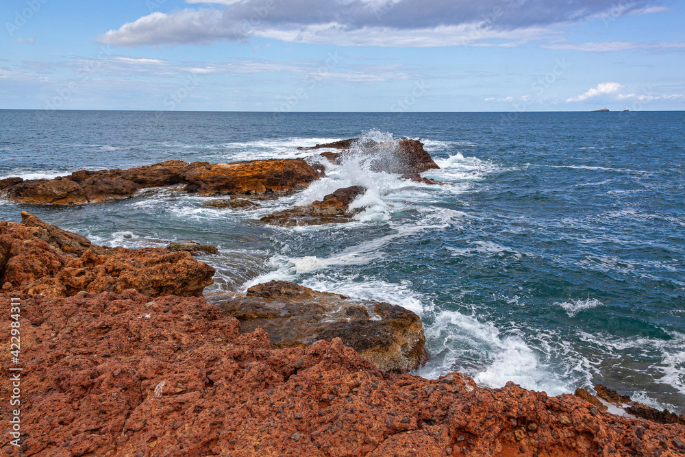 Picturesque view of red rocks and Mediterranean sea from the cape Cabo de Palos, Murcia, Spain Picturesque view of red rocks and Mediterranean sea from the cape Cabo de Palos, Murcia, Spain
