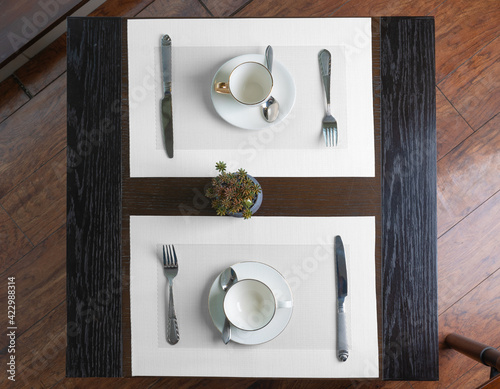 Blank white table placemat on cafe table from a top angle view photo