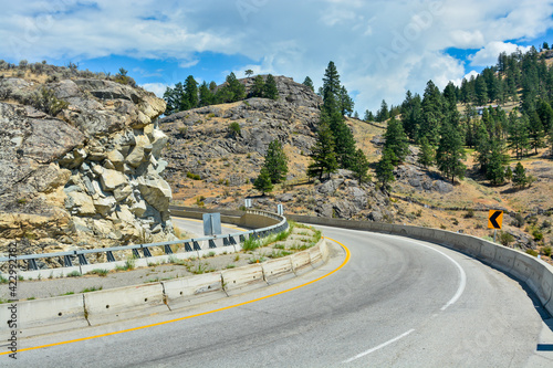 Tight turn on mountain road in Okanagan valley, British Columbia. photo