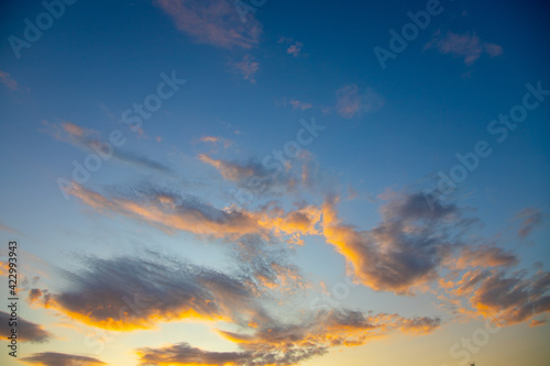 Sunset sky with pink yellow and orange clouds. © Павел Мещеряков
